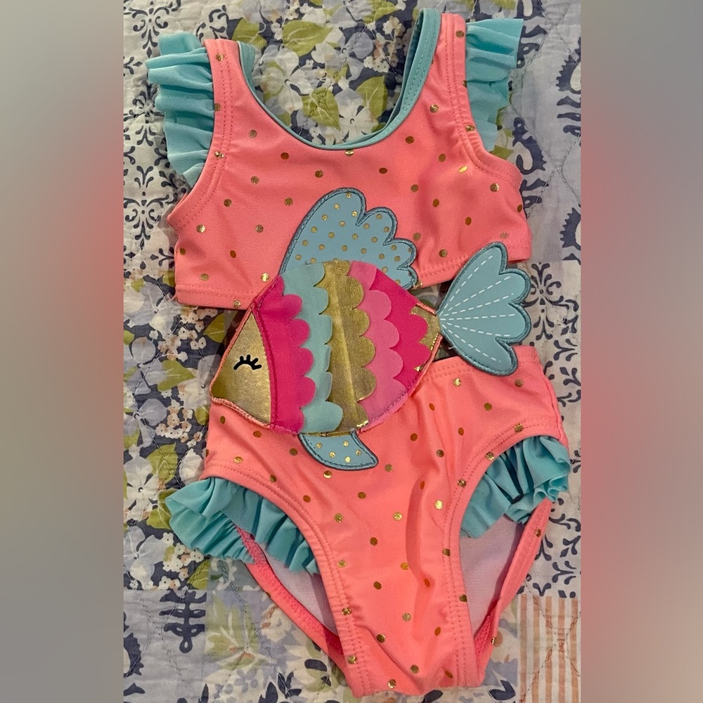 Brand new Wetsuit brand swimsuit size newborn. Adorable Fish and ruffle detail